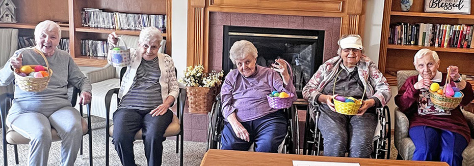 Ladies from Meadow Ridge and Meadow View hold up their Easter baskets