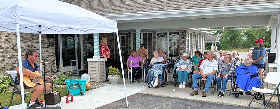 Folks enjoy music outside during the Summer Family Party.