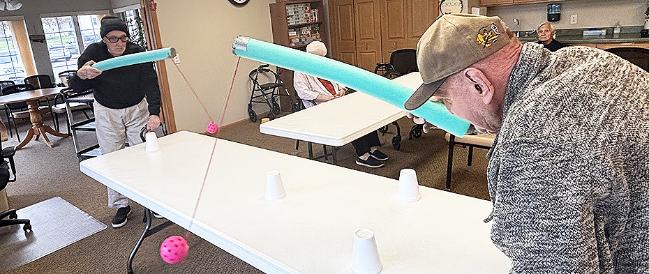Meadow Ridge men played hand-eye coordination games